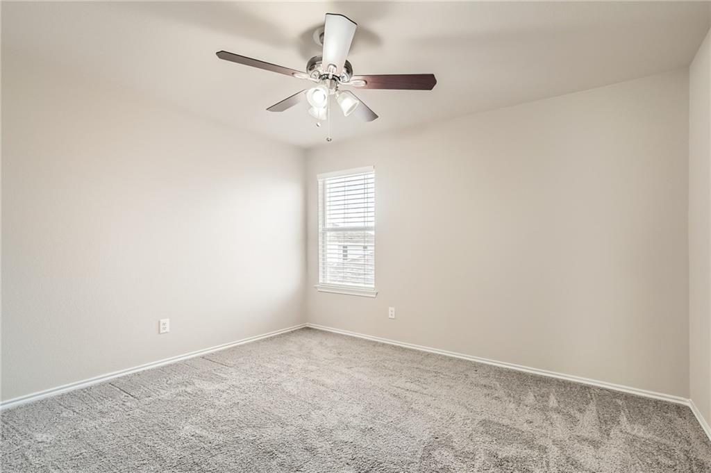 612 Copper Court Jarrell, TX 76537 - Photo 20 of 27 an empty room with windows and fan