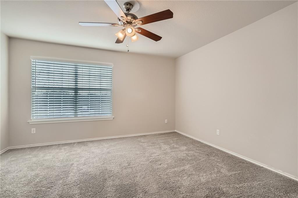 612 Copper Court Jarrell, TX 76537 - Photo 21 of 27 an empty room with a window and a fan