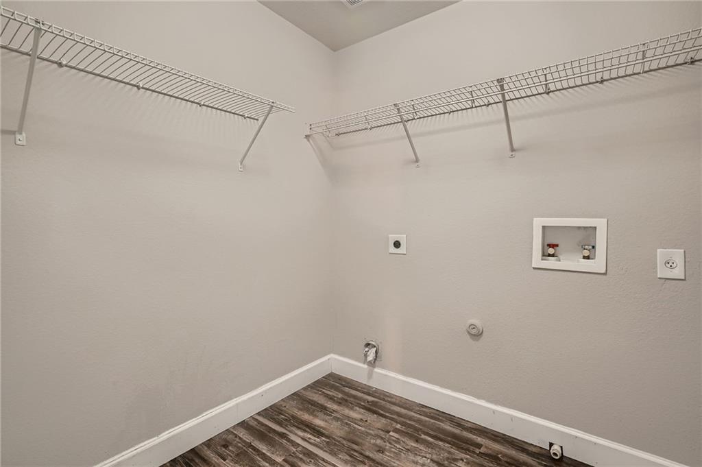 612 Copper Court Jarrell, TX 76537 - Photo 23 of 27 a view of a room with racks on the wall