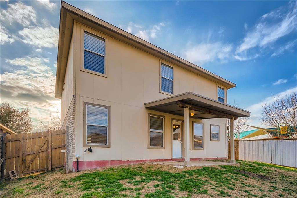 612 Copper Court Jarrell, TX 76537 - Photo 24 of 27 a front view of a house with garden