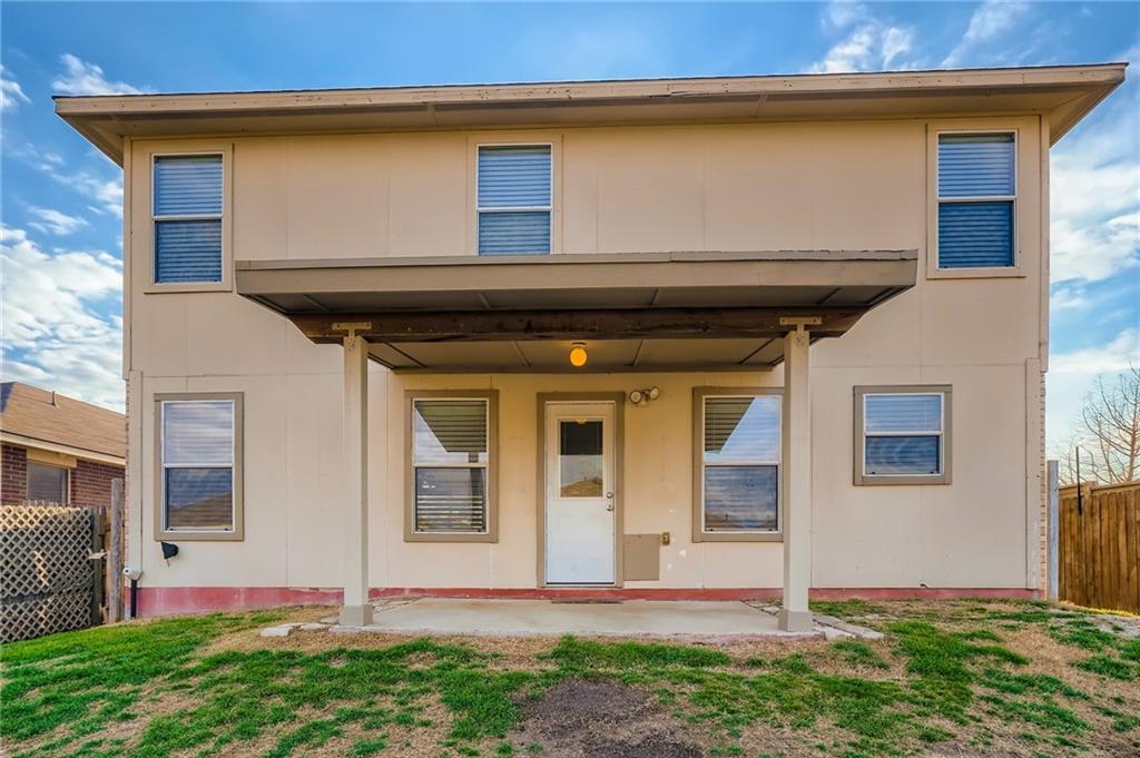 612 Copper Court Jarrell, TX 76537 - Photo 25 of 27 a front view of a house with garden