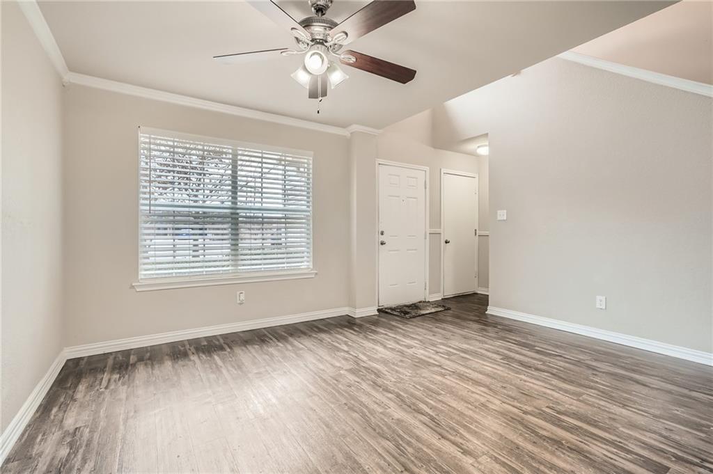 612 Copper Court Jarrell, TX 76537 - Photo 7 of 27 wooden floor in an empty room with a window