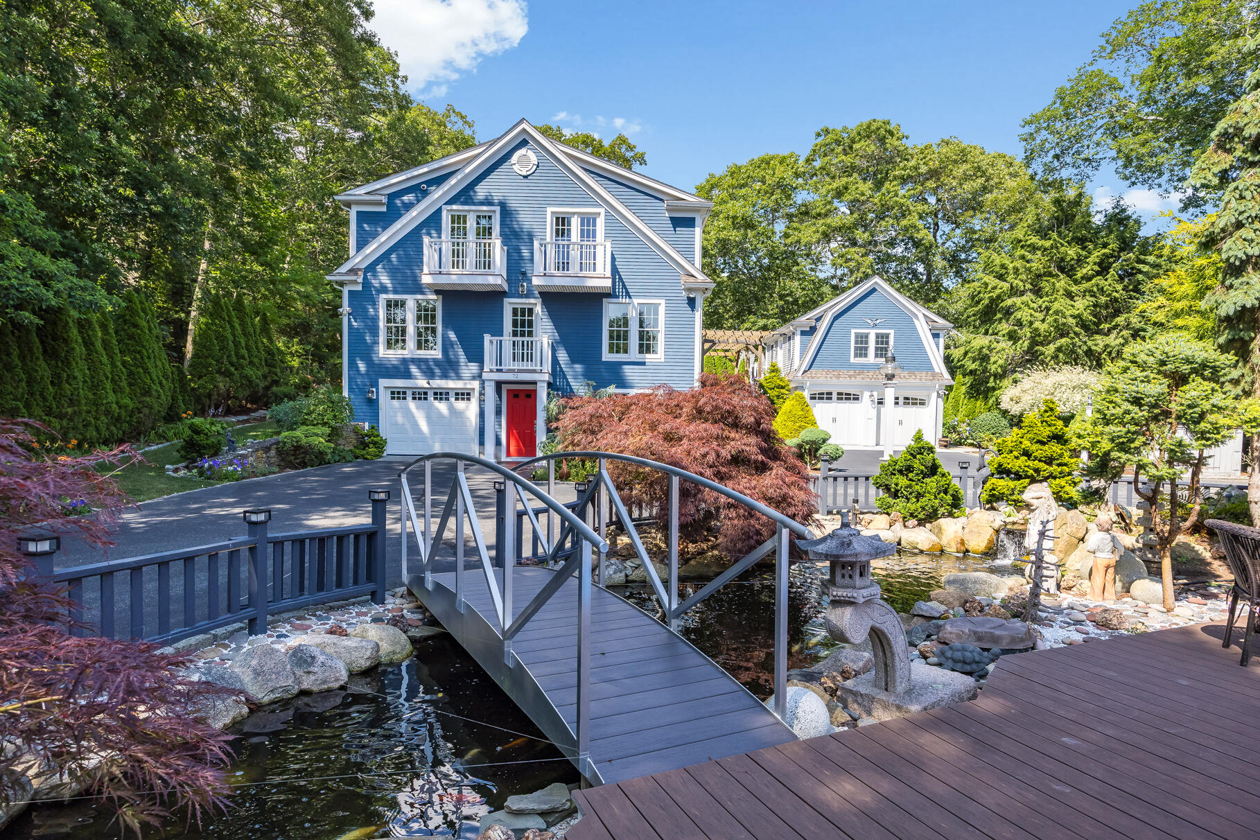 72 River Road Marstons Mills, MA 02648 - Photo 11 of 65 a front view of a house with yard and furniture