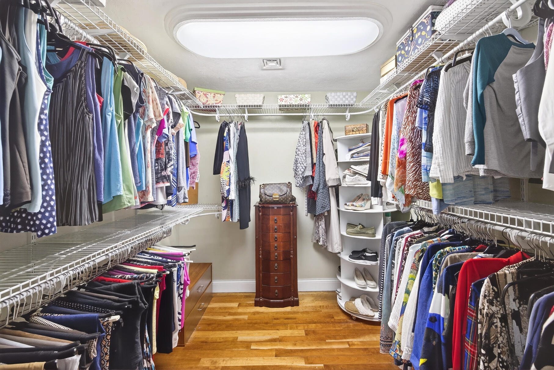 72 River Road Marstons Mills, MA 02648 - Photo 37 of 65 a view of walk in closet with clothes