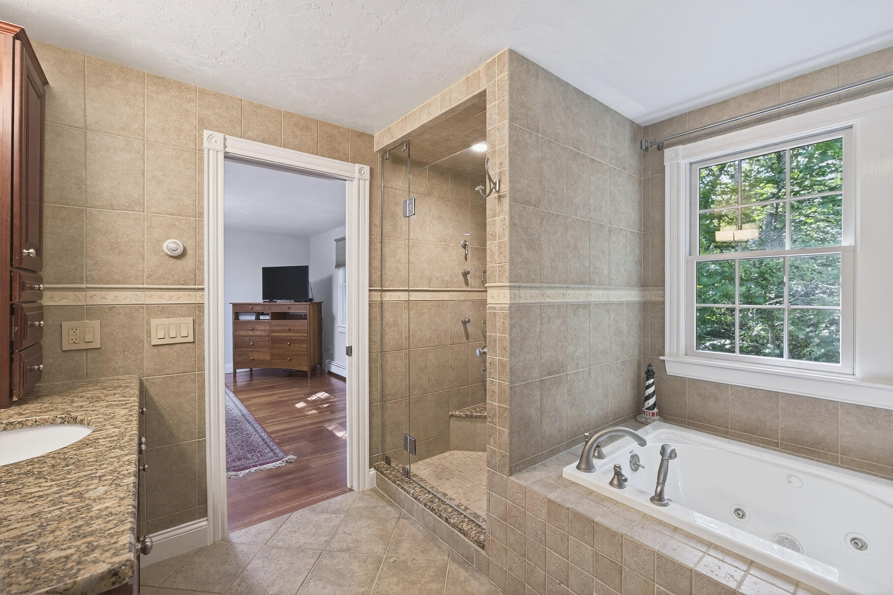 72 River Road Marstons Mills, MA 02648 - Photo 40 of 65 a bathroom with a bathtub and a shower