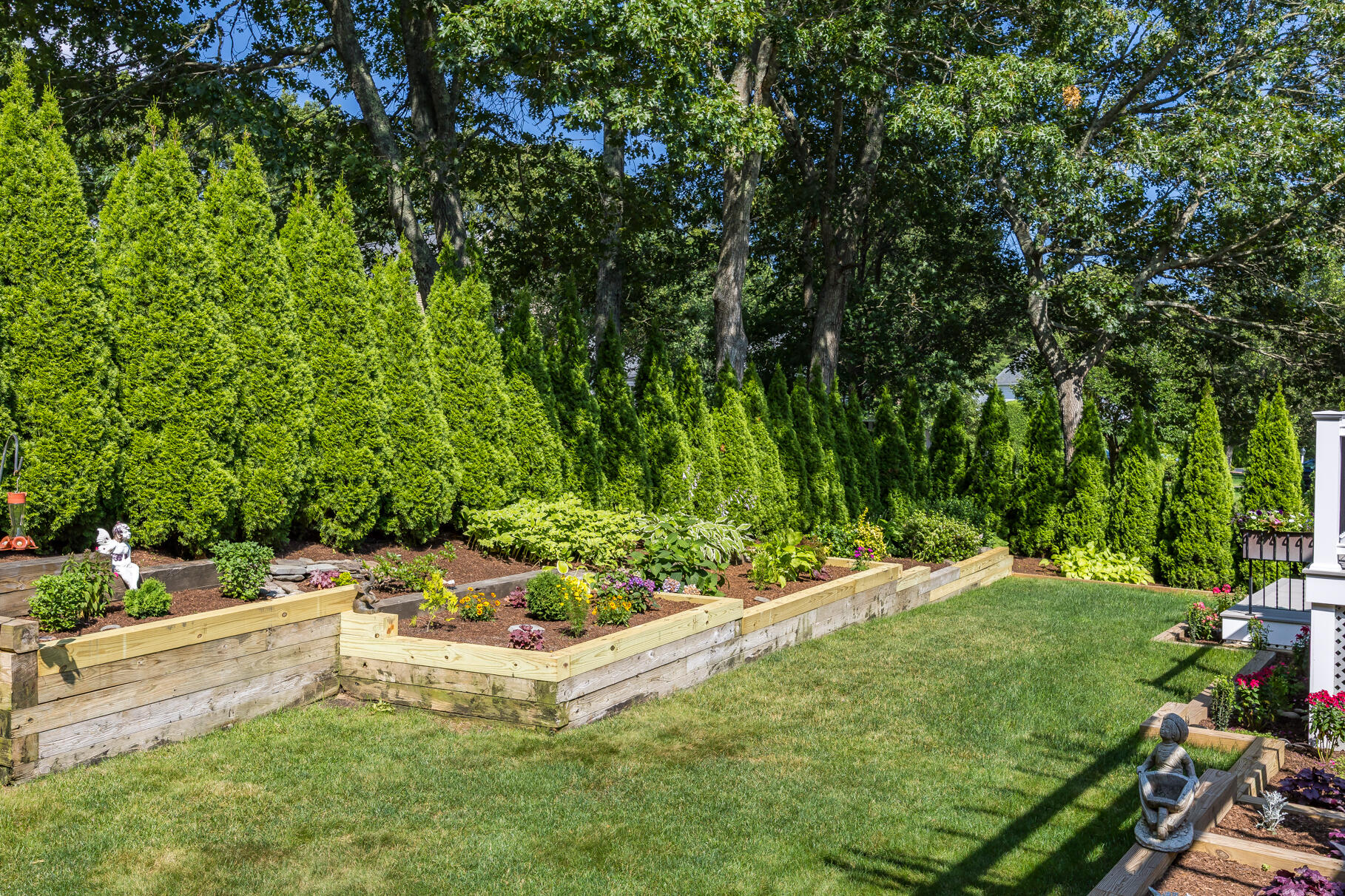 72 River Road Marstons Mills, MA 02648 - Photo 57 of 65 a view of a backyard with table and chairs