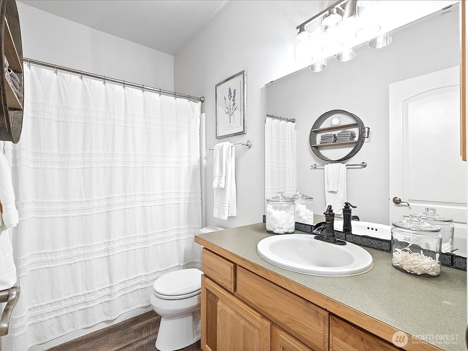 33606 Northeast Lake Joy Road Carnation, WA 98014 - Photo 23 of 40 a bathroom with a sink a toilet and a mirror