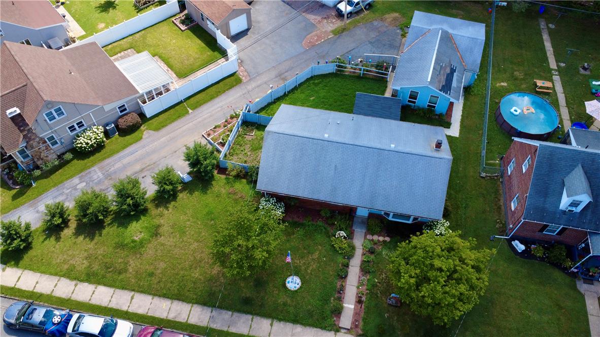 719 Keystone Avenue Bethlehem, PA 18018 - Photo 3 of 32 An aerial perspective reveals the residential setting with mature trees and a fenced yard.