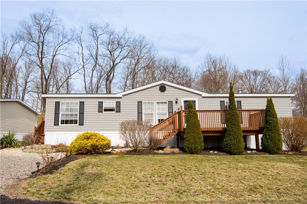 627 Deana Way Rochester, PA 15074 - Photo 1 of 17 a front view of a house with garden