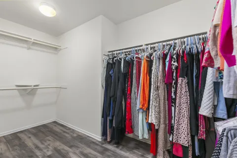 a living room with furniture gym equipment and windows