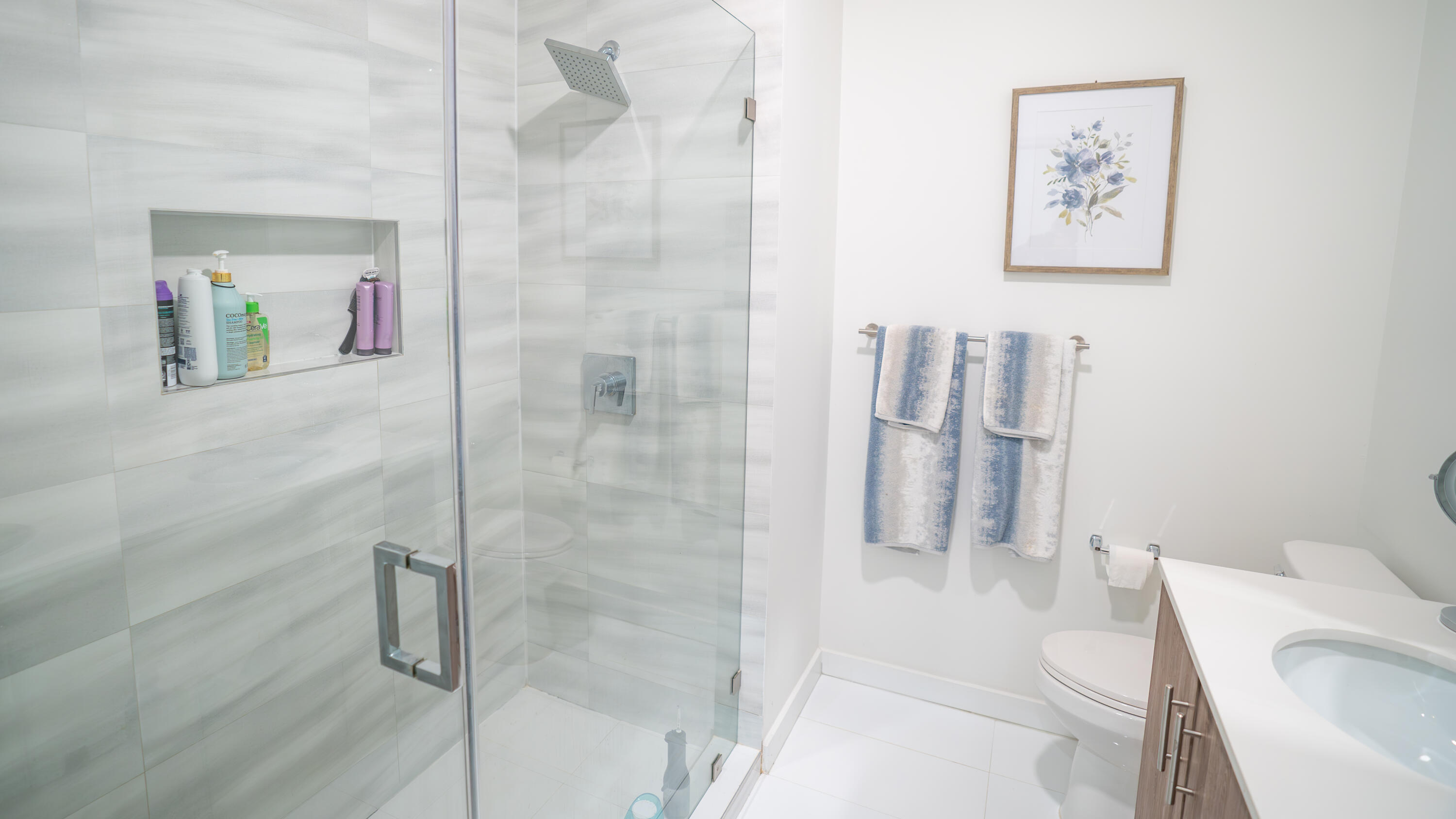 1330 Crystal Way, Unit 107 Delray Beach, FL 33444 - Photo 11 of 23 a bathroom with a shower and toilet