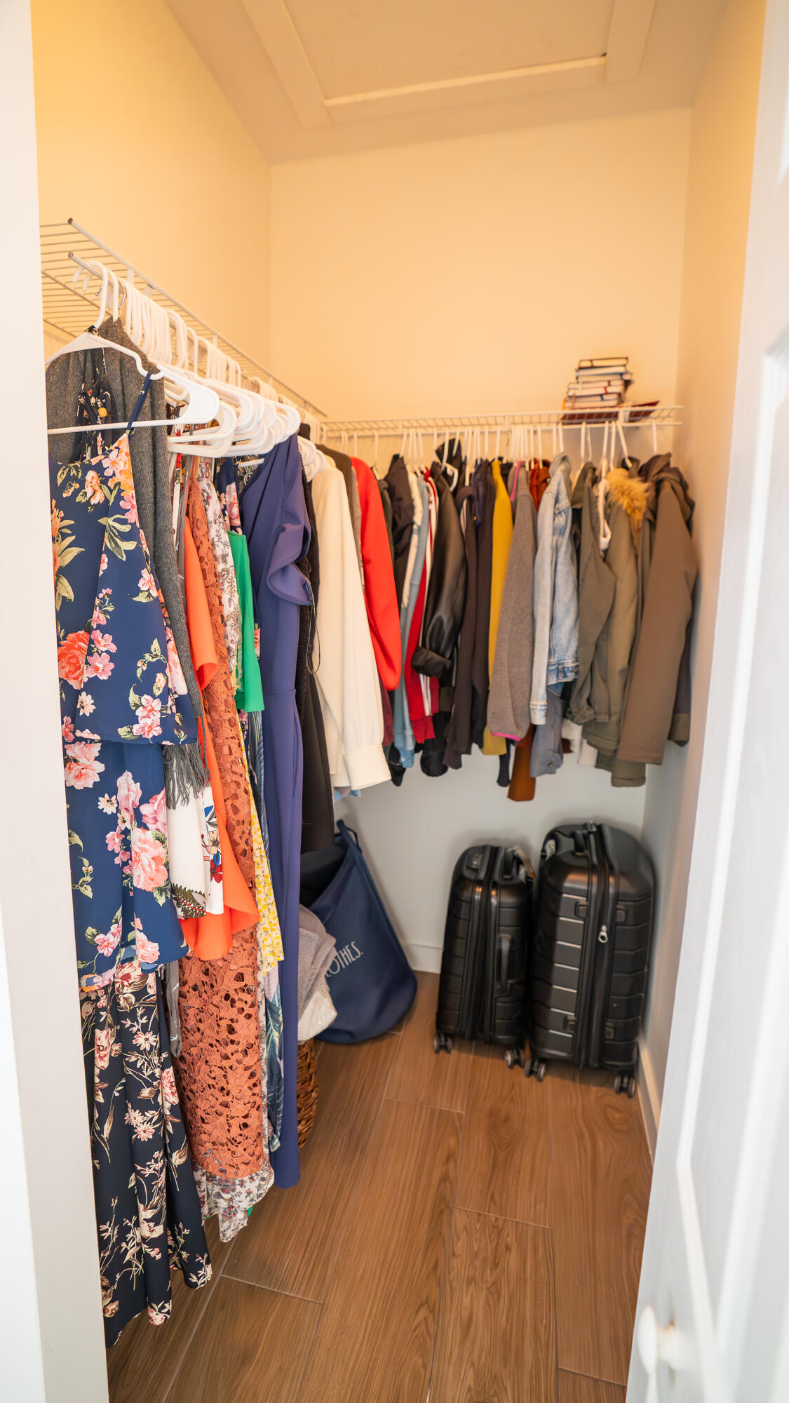 1330 Crystal Way, Unit 107 Delray Beach, FL 33444 - Photo 12 of 23 a view of walk in closet with clothes and shoes