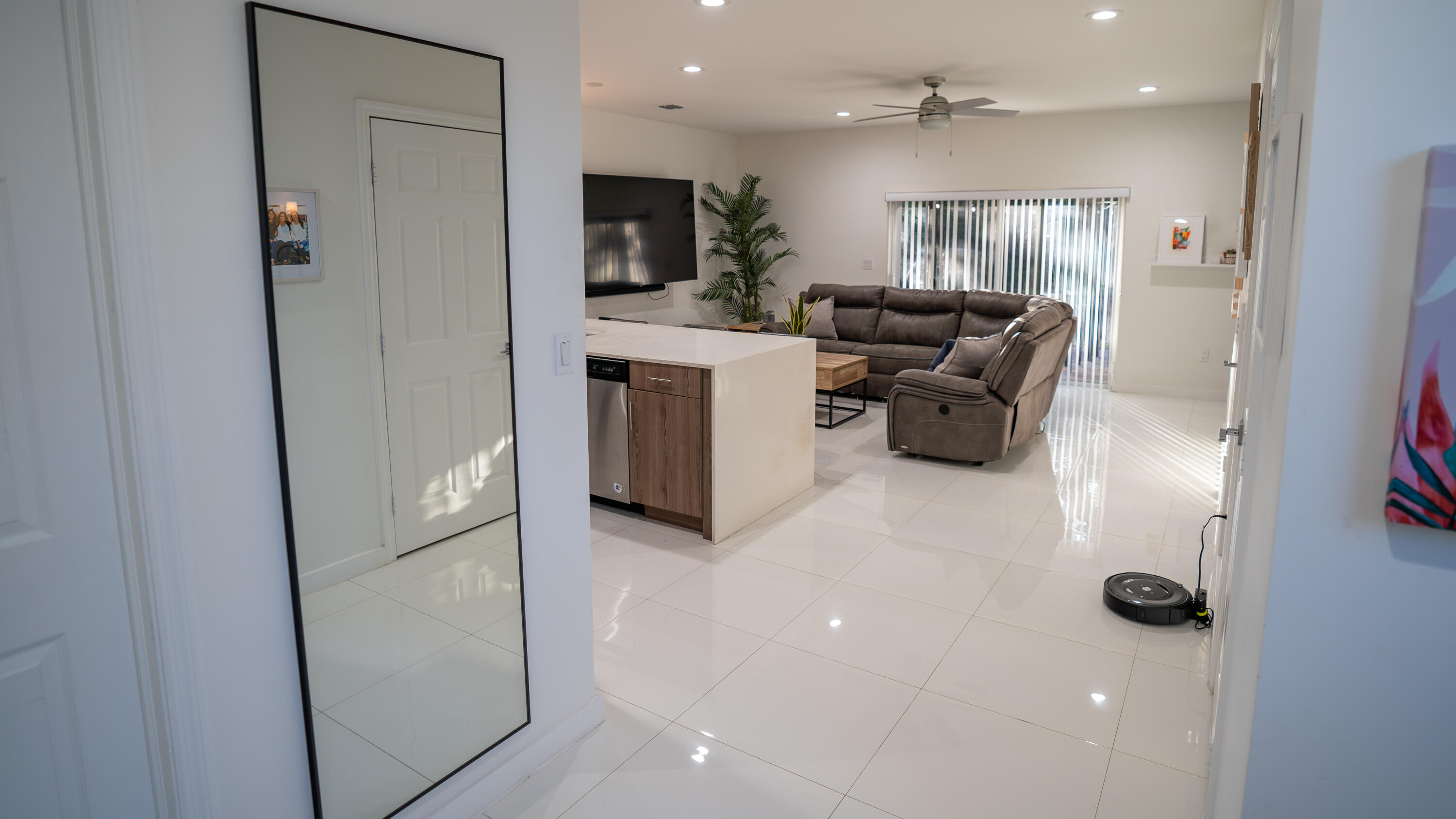 1330 Crystal Way, Unit 107 Delray Beach, FL 33444 - Photo 2 of 23 a living room with furniture and a flat screen tv