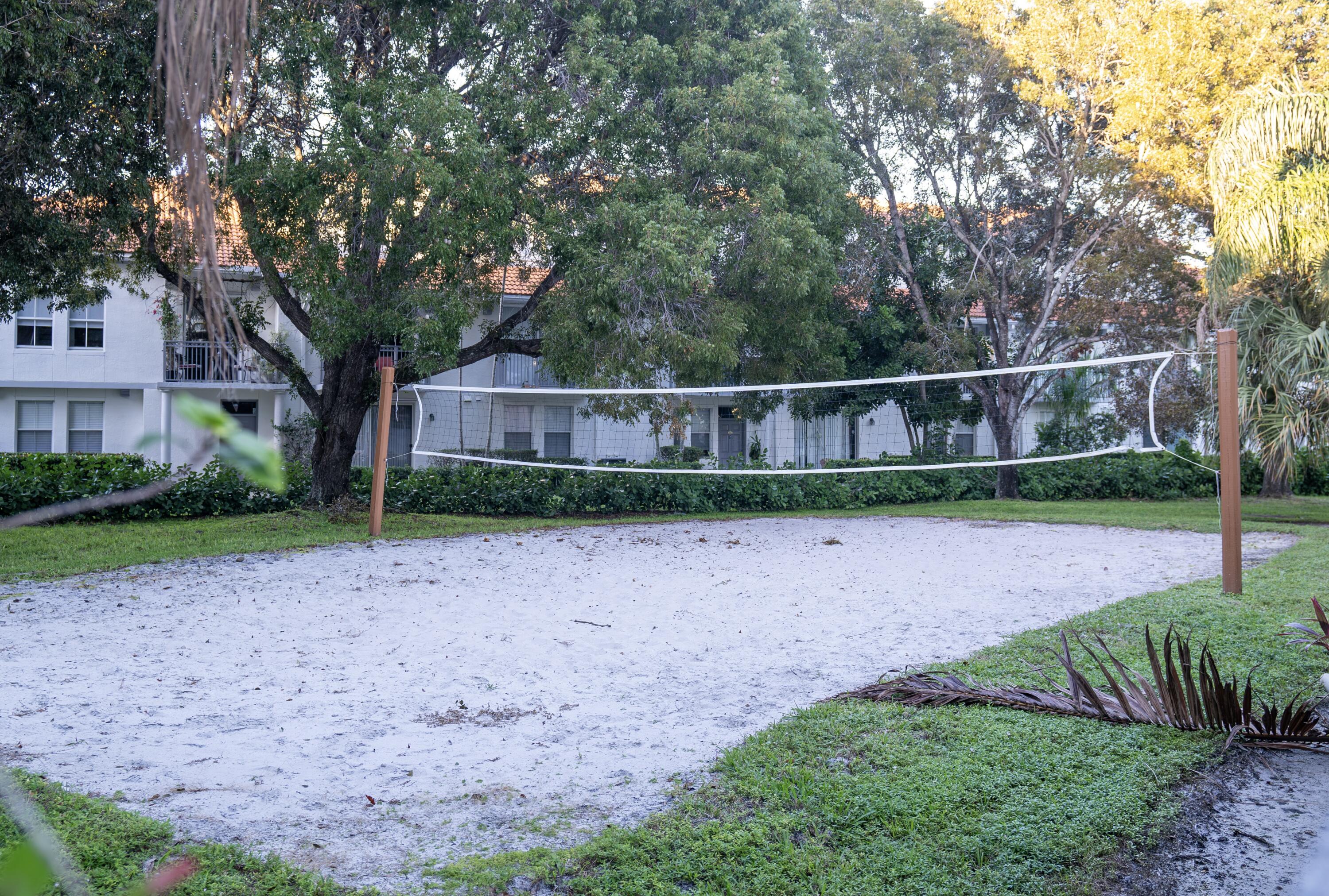 1330 Crystal Way, Unit 107 Delray Beach, FL 33444 - Photo 22 of 23 a view of a house with a yard