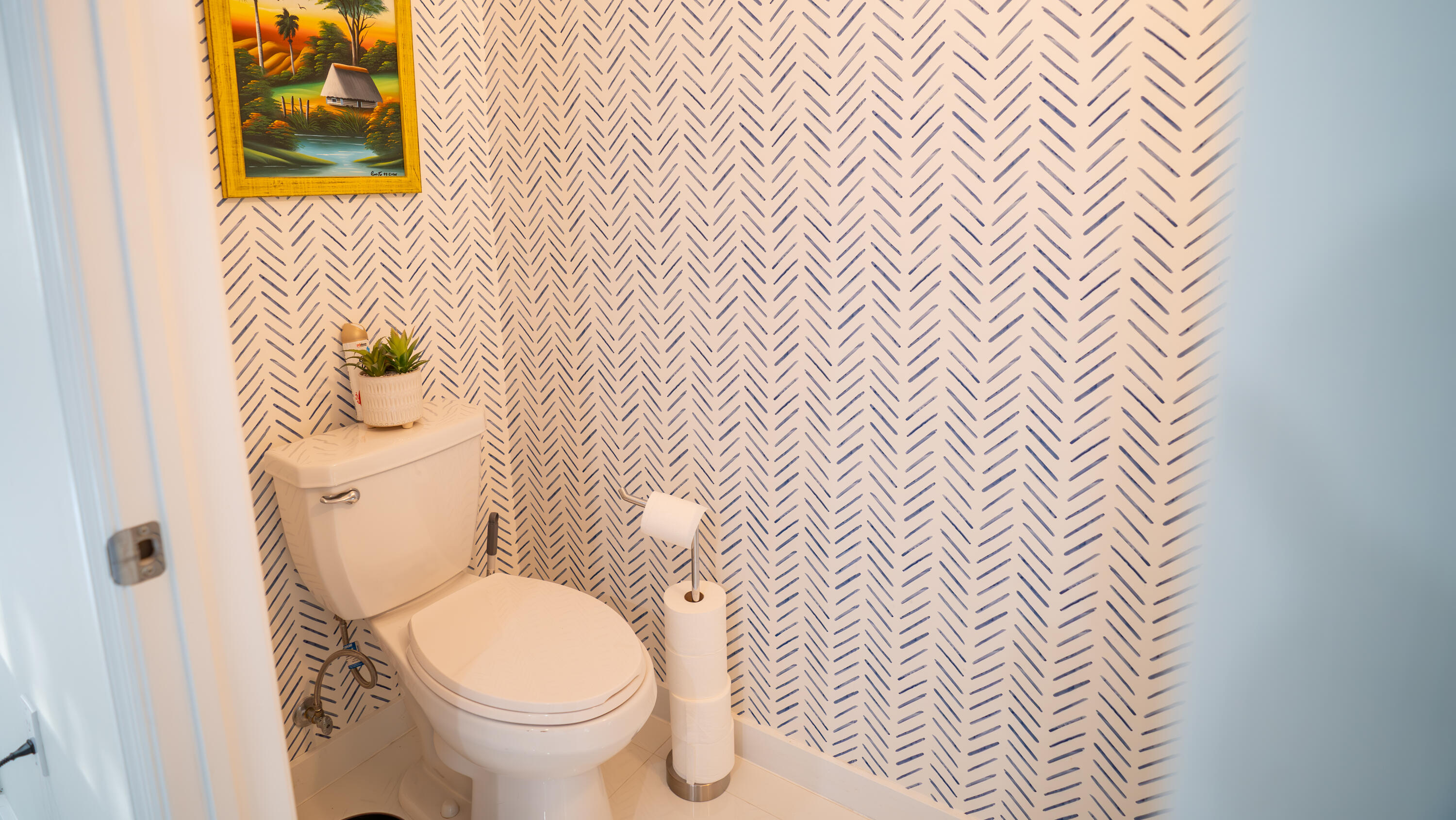 1330 Crystal Way, Unit 107 Delray Beach, FL 33444 - Photo 7 of 23 a white toilet sitting next to a white wall