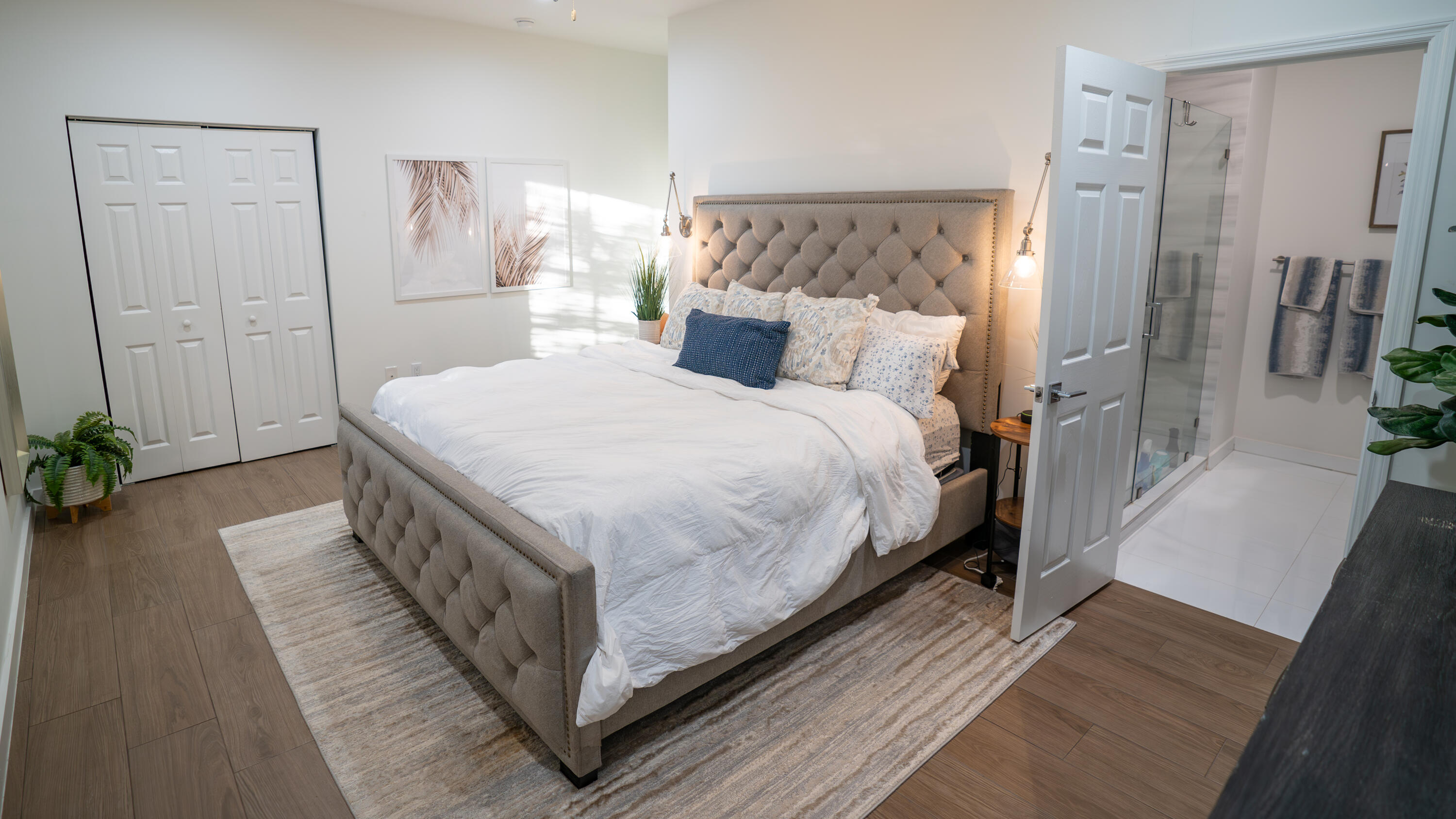 1330 Crystal Way, Unit 107 Delray Beach, FL 33444 - Photo 9 of 23 a bed room with a bed and a couch