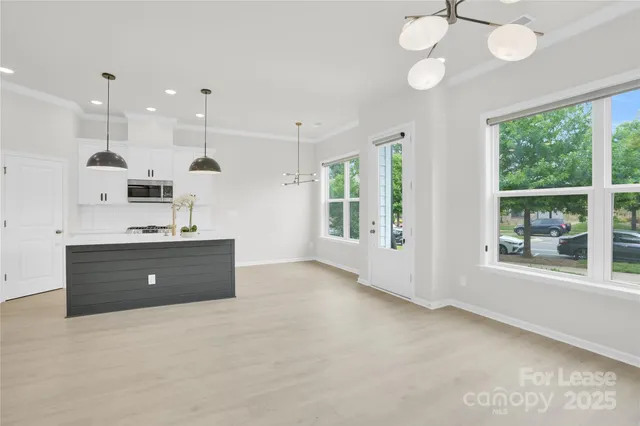 a room with a large bed and a large window