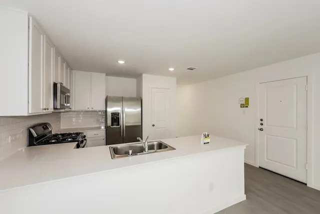 a view of a kitchen with a sink