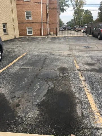 a view of a parking space with car parked