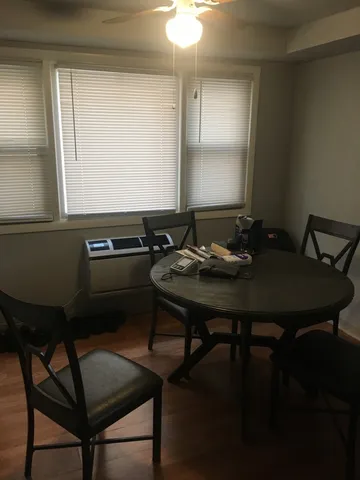 a table that has a table and chairs in it