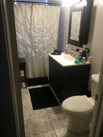 a bathroom with a toilet and a sink