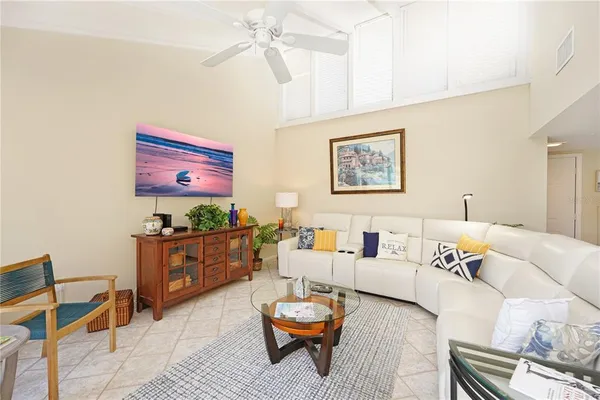 a living room with furniture and a rug