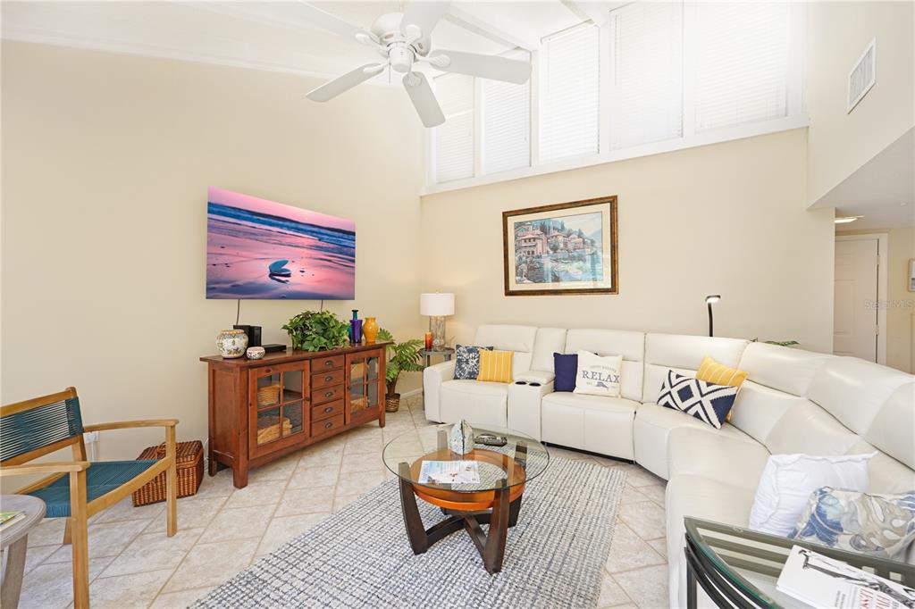 5903 43rd Street West, Unit 5903 Bradenton, FL 34210 - Photo 5 of 12 a living room with furniture and a rug