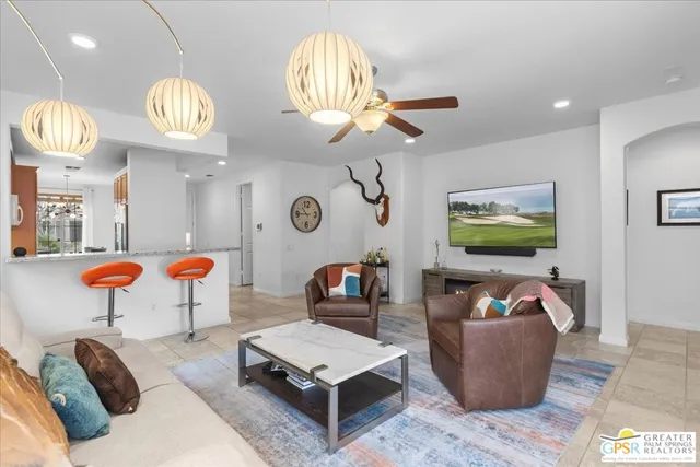 a kitchen with stainless steel appliances granite countertop a sink and a refrigerator