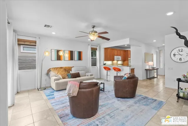 a view of a kitchen with a sink and a large window