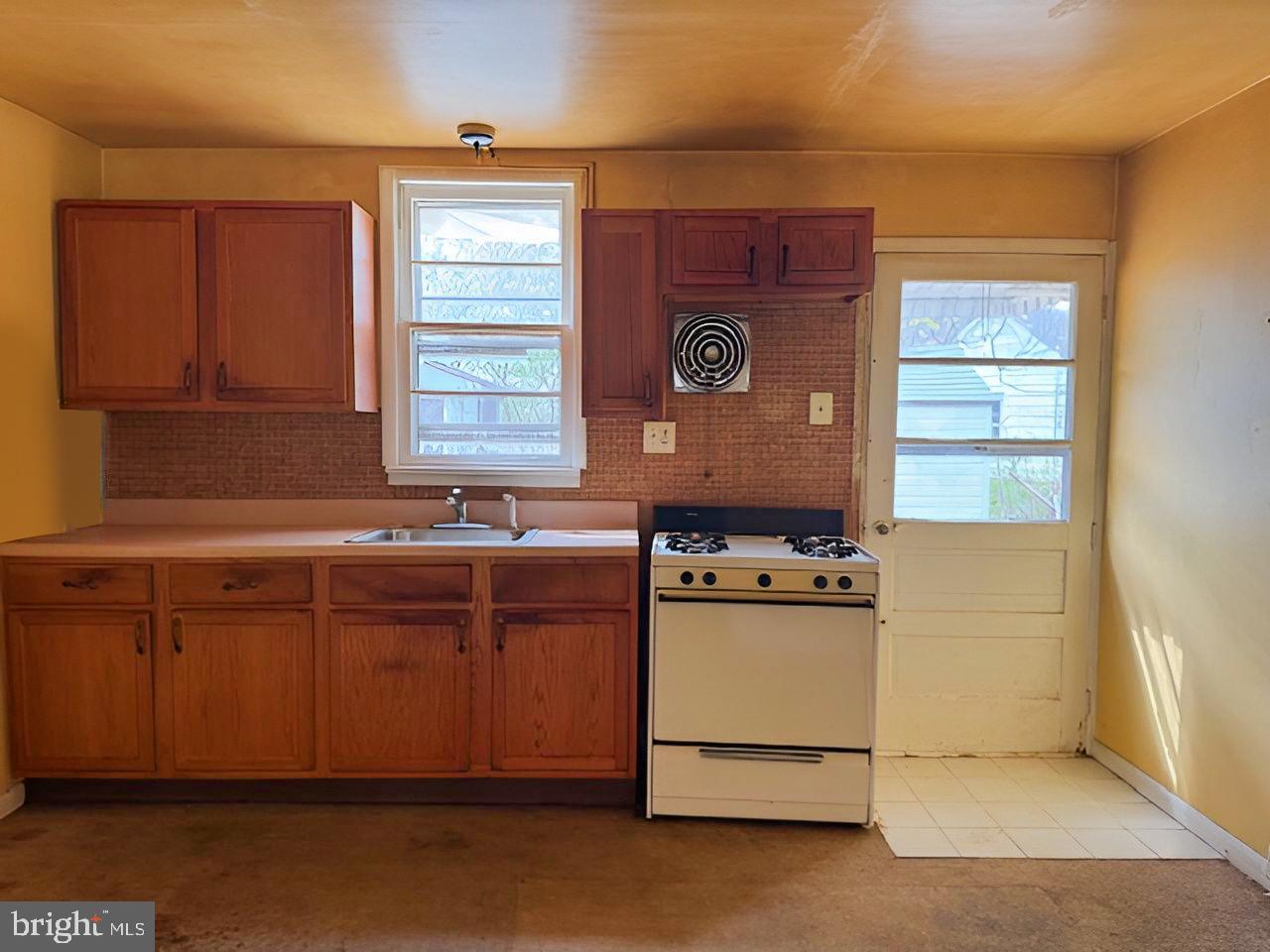 465 Berkley Road Mantua, NJ 08051 - Photo 7 of 12 a kitchen with stainless steel appliances granite countertop cabinets and a window