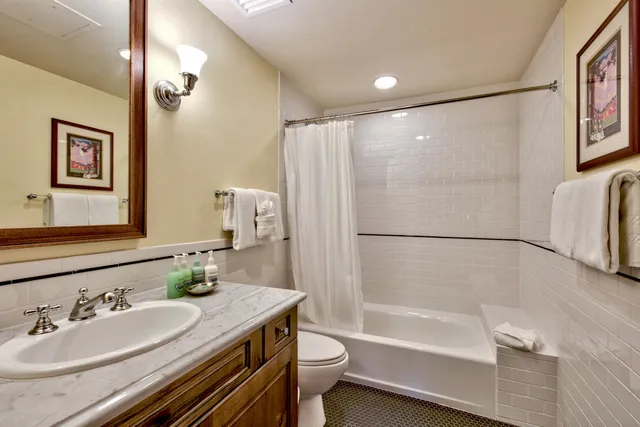 a spacious bedroom with a bed and a large window