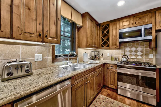 a view of a kitchen and dining area