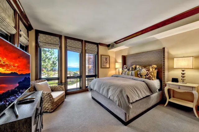 a bathroom with a granite countertop sink a toilet and a mirror