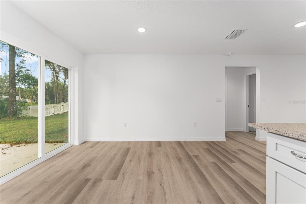 13119 Northeast 7th Loop Silver Springs, FL 34488 - Photo 24 of 51 a view of wooden floor and brick walls