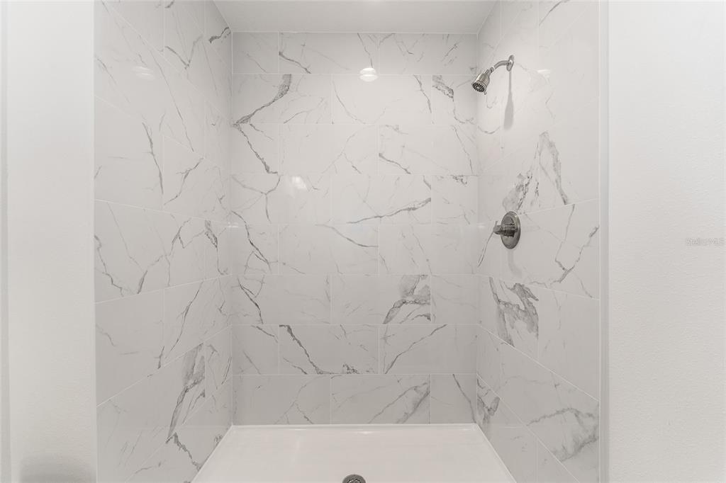 13119 Northeast 7th Loop Silver Springs, FL 34488 - Photo 31 of 51 a bathroom with a shower