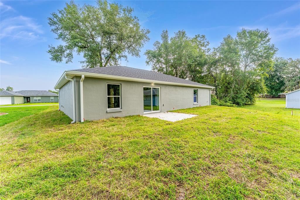 13119 Northeast 7th Loop Silver Springs, FL 34488 - Photo 46 of 51 a house with swimming pool in front of it