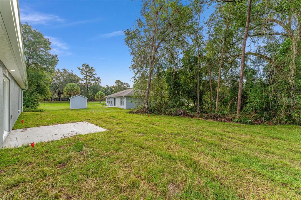 13119 Northeast 7th Loop Silver Springs, FL 34488 - Photo 51 of 51 a view of building with trees in the background