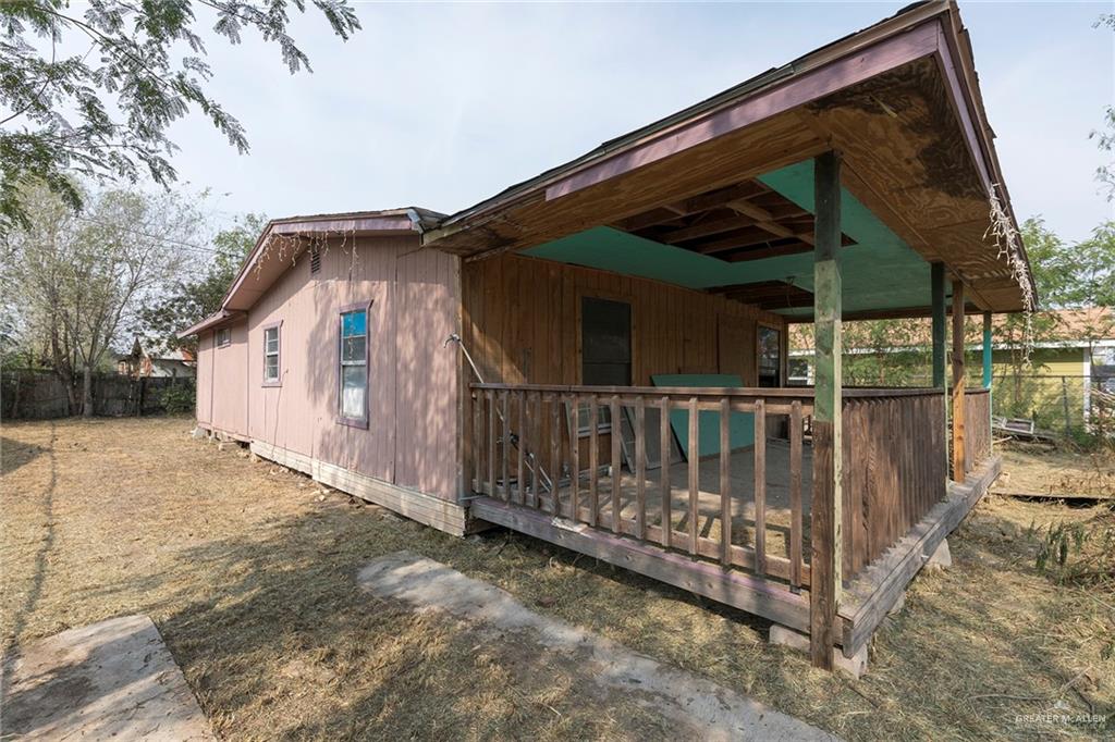 a view of house with wooden fence