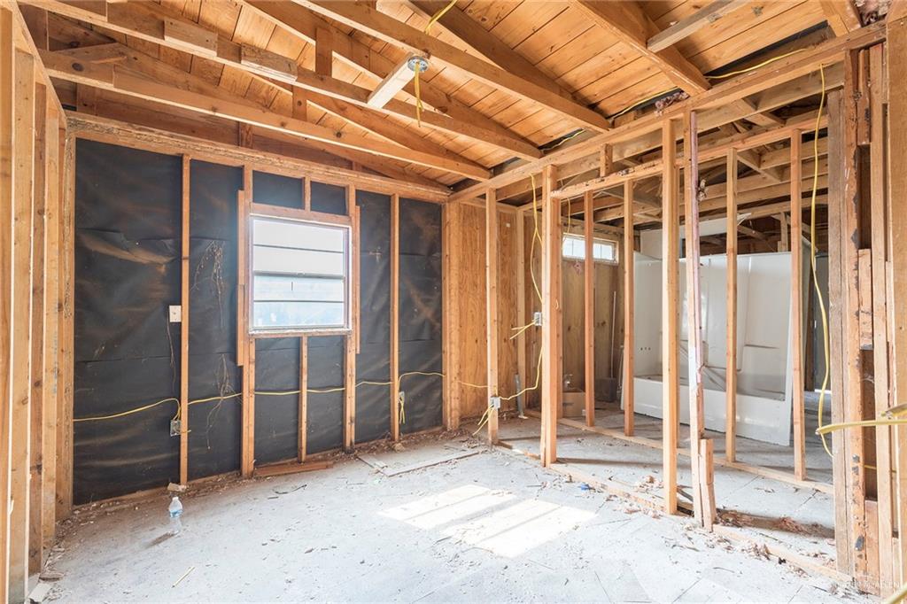 7516 South Naranja Lane Pharr, TX 78577 - Photo 3 of 11 a view of an empty room with wooden walls
