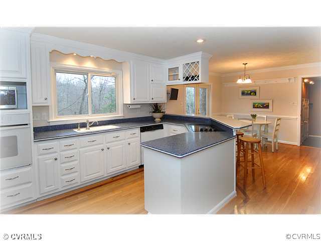 3030 Middlewood Road Midlothian, VA 23113 - Photo 5 of 20 a kitchen with a sink window and cabinets