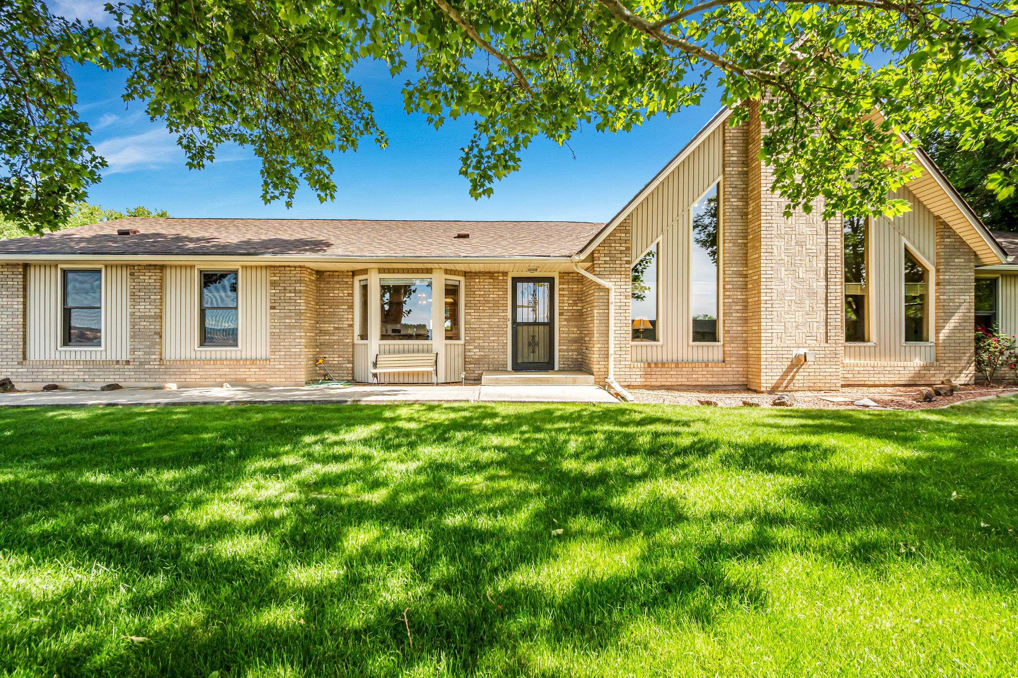2648 H Road Grand Junction, CO 81506 - Photo 1 of 27 a view of a house with backyard and a tree