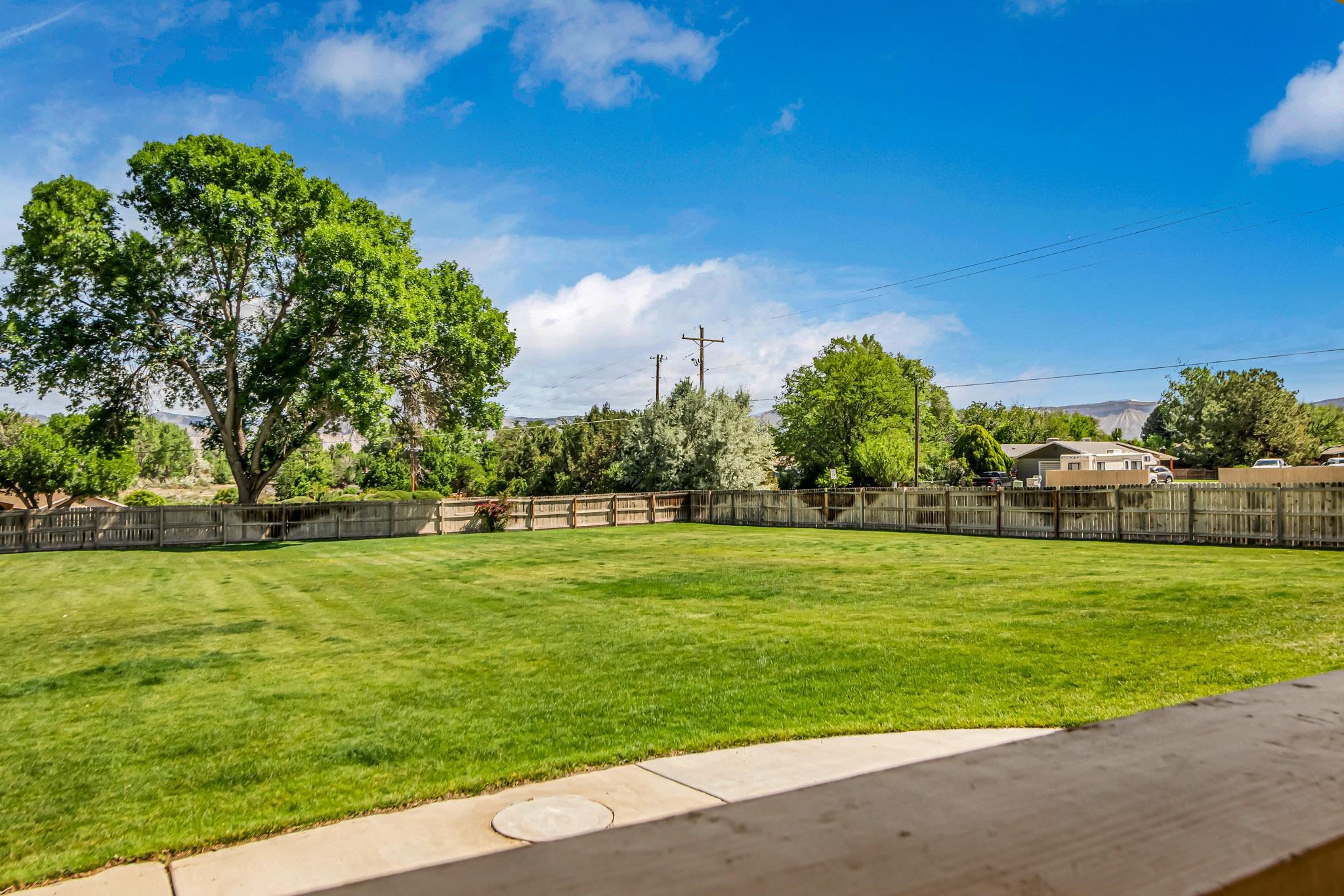 2648 H Road Grand Junction, CO 81506 - Photo 12 of 27 a view of a golf course with a lake