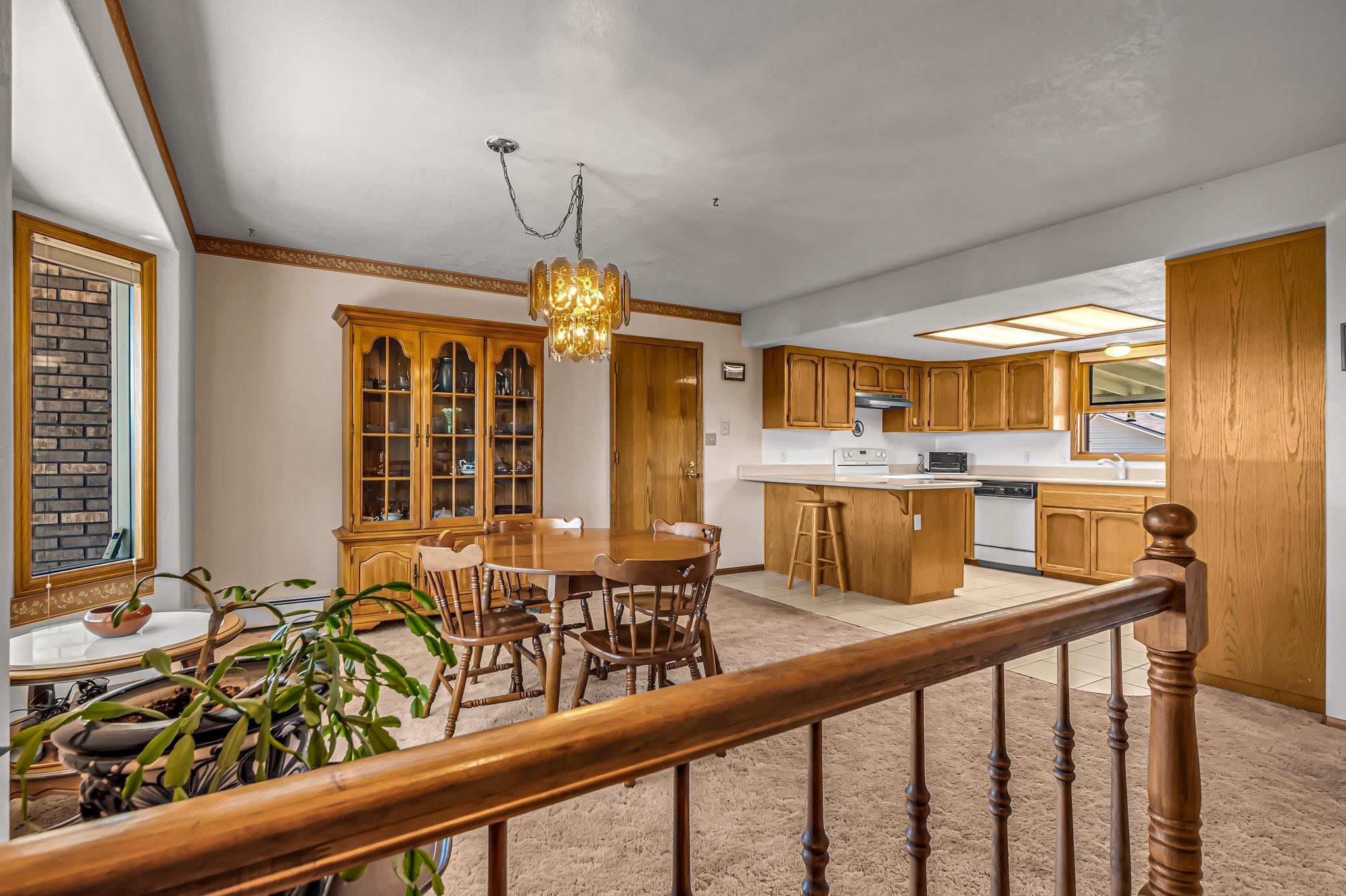 2648 H Road Grand Junction, CO 81506 - Photo 13 of 27 a view of a dining room with furniture window and wooden floor