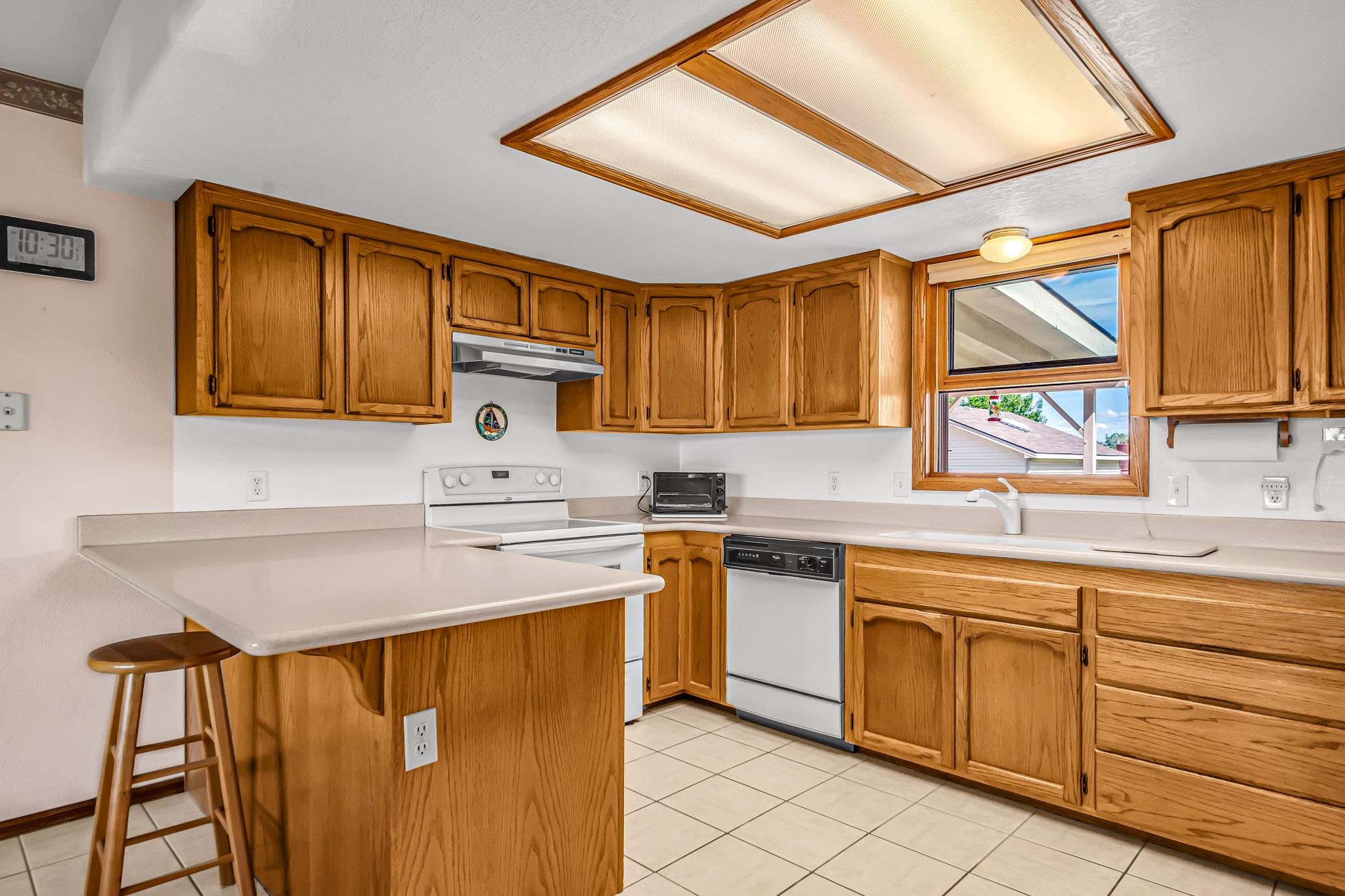 2648 H Road Grand Junction, CO 81506 - Photo 16 of 27 a kitchen with stainless steel appliances granite countertop a sink and cabinets