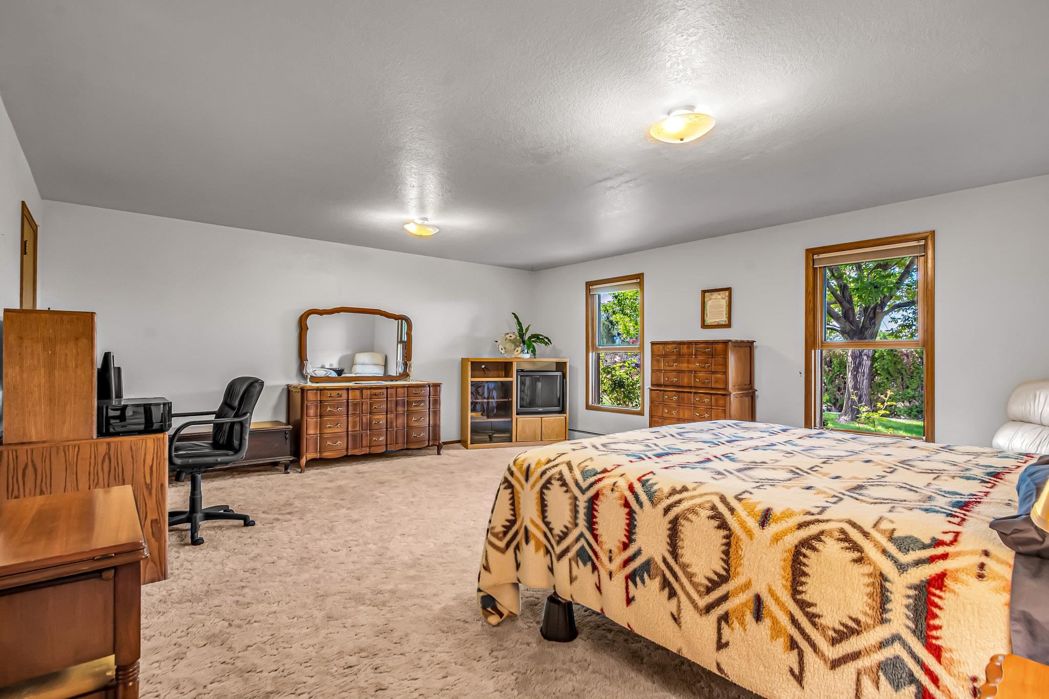 2648 H Road Grand Junction, CO 81506 - Photo 20 of 27 a bedroom with a bed and a large window