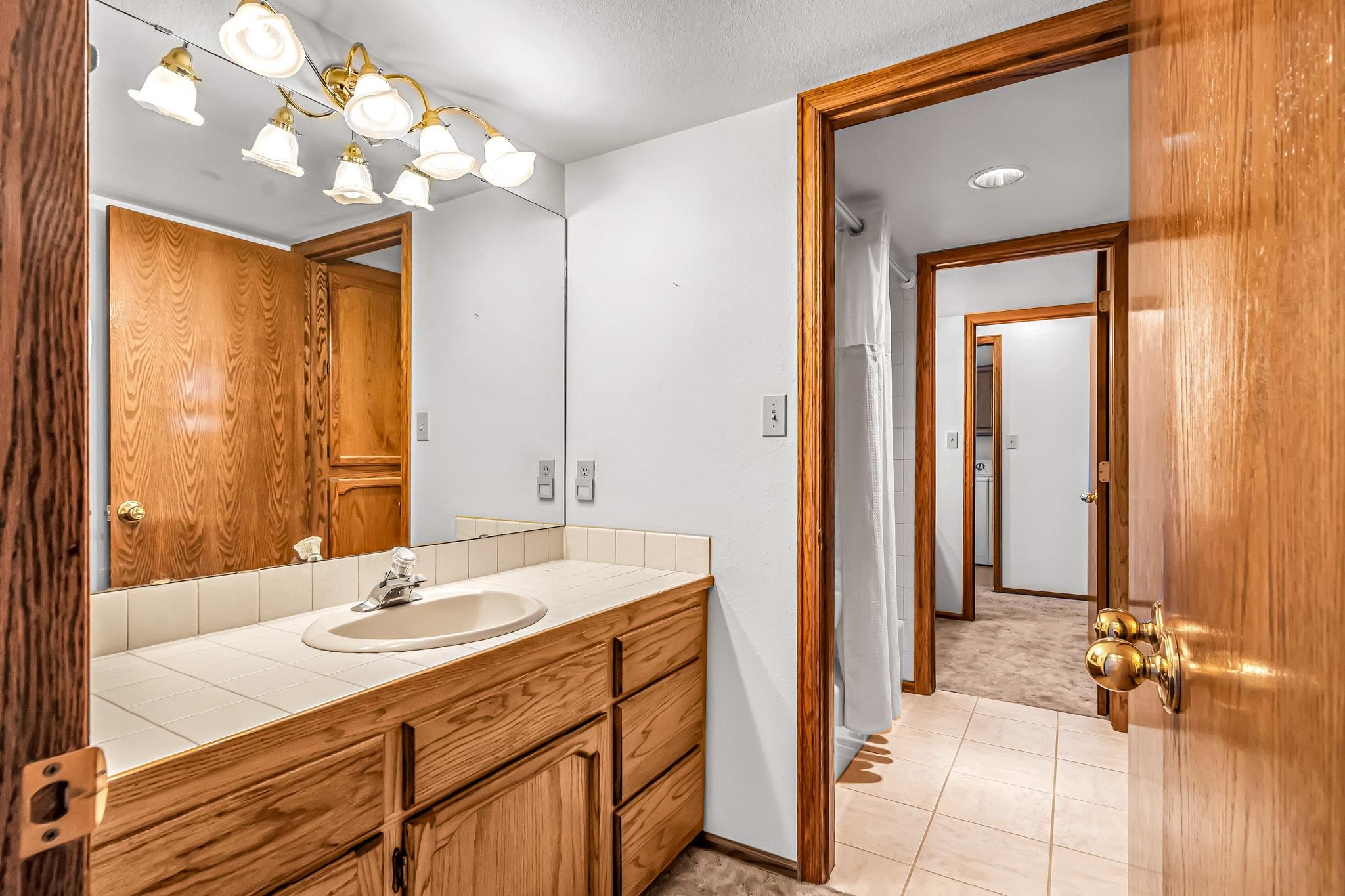 2648 H Road Grand Junction, CO 81506 - Photo 21 of 27 a bathroom with a sink vanity and a mirror