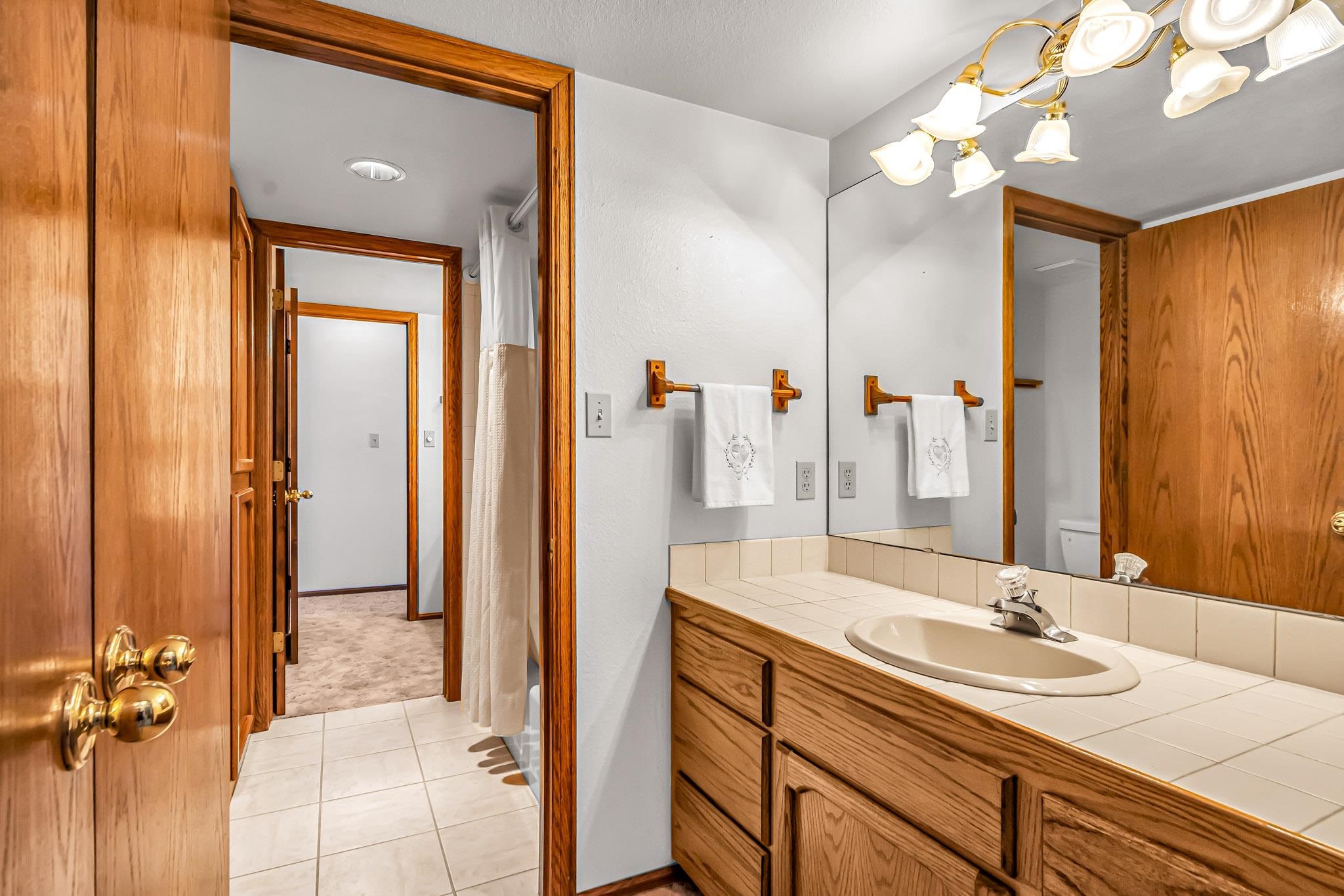 2648 H Road Grand Junction, CO 81506 - Photo 22 of 27 a bathroom with a sink and a mirror