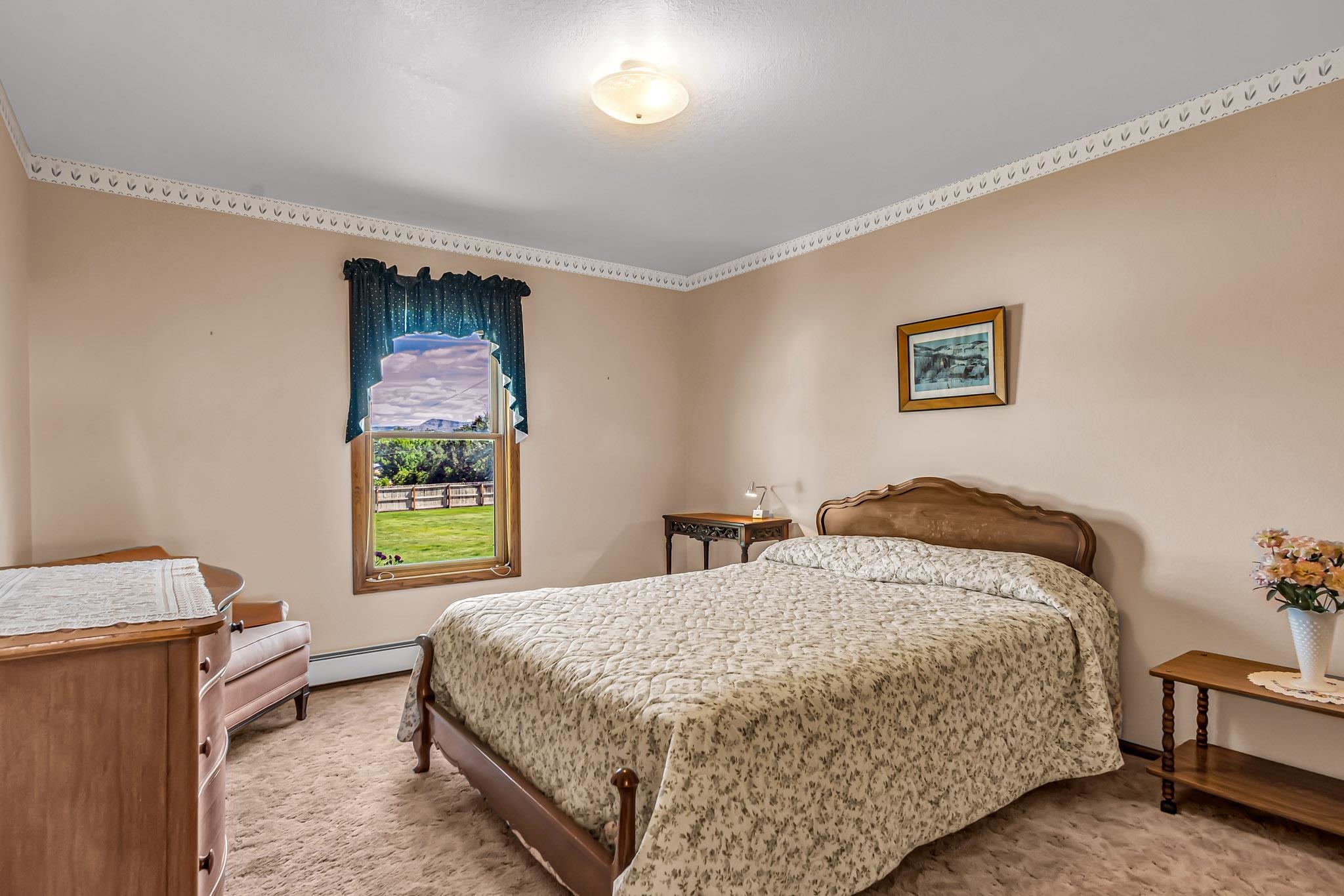 2648 H Road Grand Junction, CO 81506 - Photo 23 of 27 a bedroom with a bed and a window
