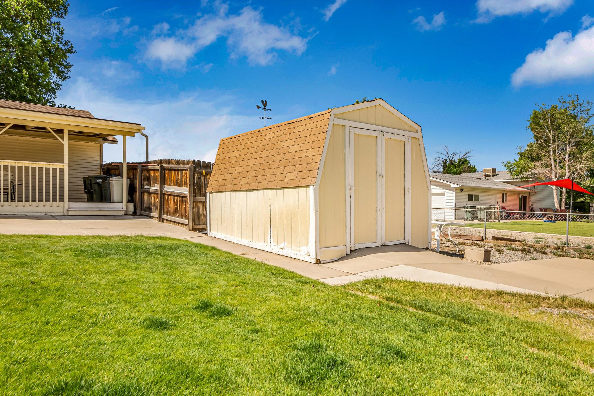 2648 H Road Grand Junction, CO 81506 - Photo 7 of 27 a view of a house with a yard