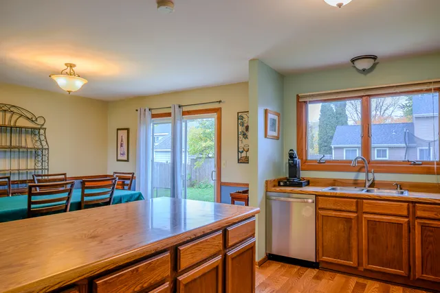a kitchen with stainless steel appliances granite countertop a sink and cabinets